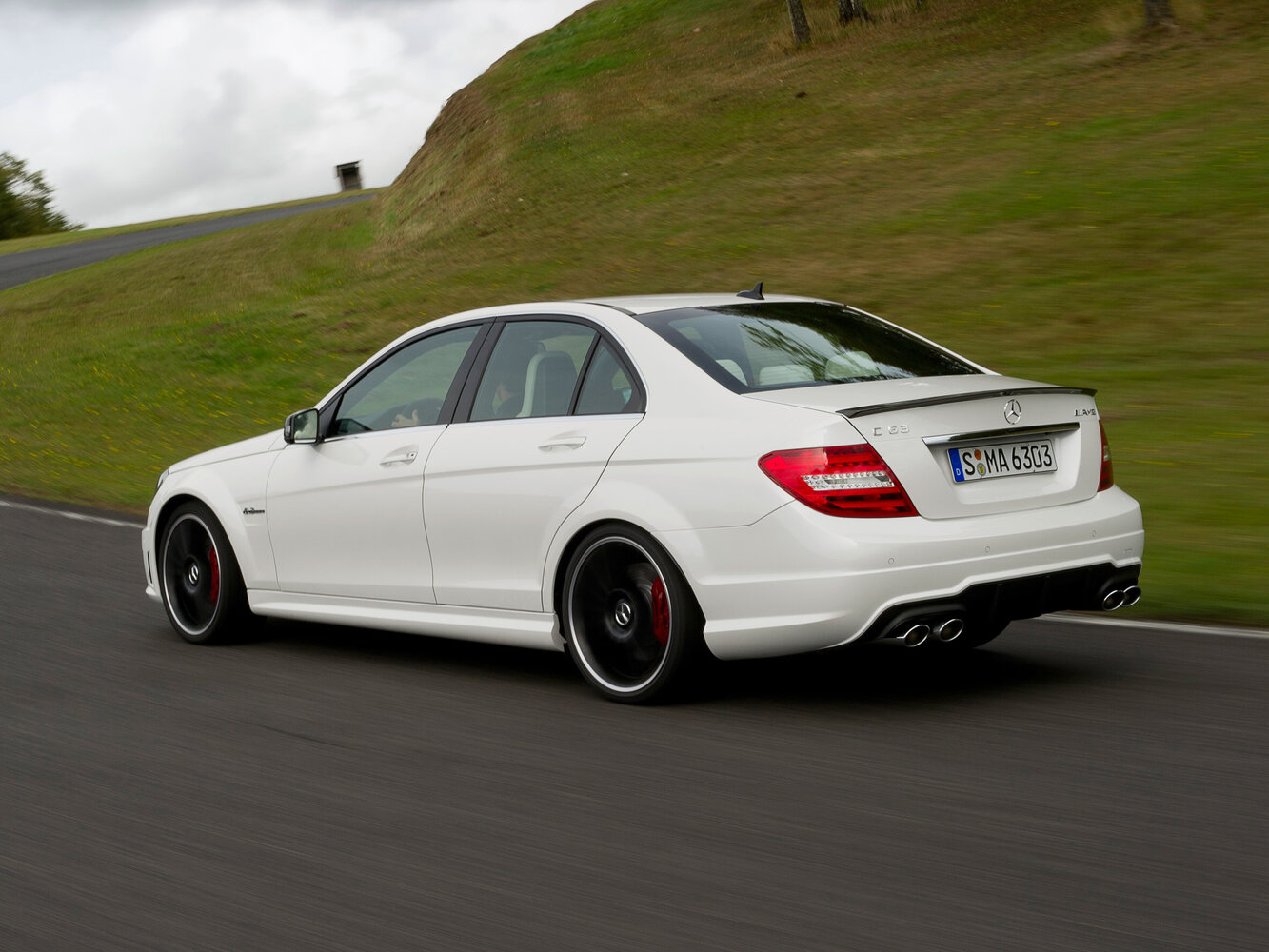 Mercedes-Benz C-Класс AMG, III (W204) Рестайлинг, 2011–2015, Седан: Вид сзади в три четверти