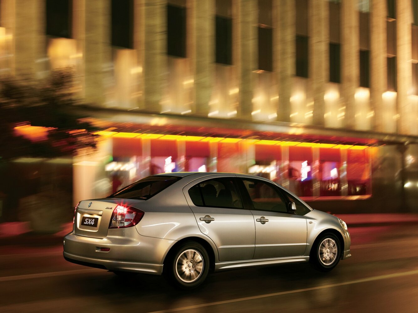 Suzuki SX4, I (Classic) Рестайлинг, 2009–2014, Седан: Вид сзади в три четверти