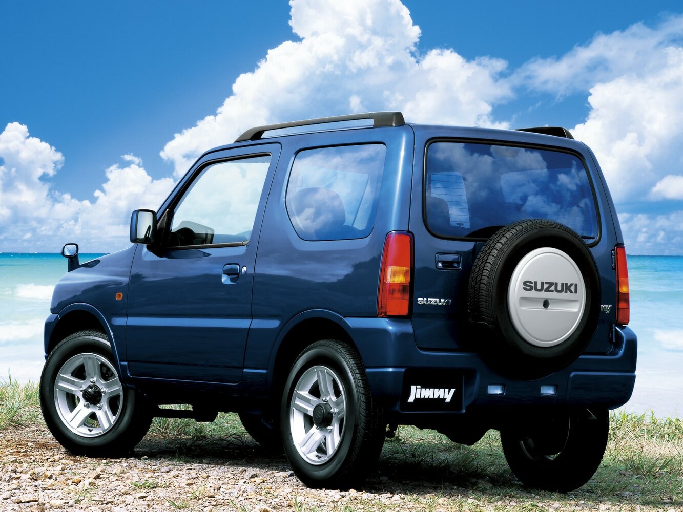 Suzuki Jimny, III Рестайлинг 1, 2005–2012, Внедорожник 3 дв. Kei car: Вид сзади в три четверти
