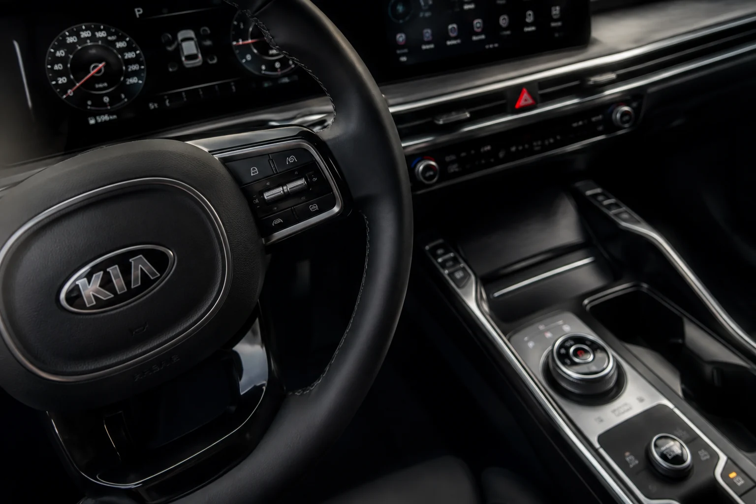 Kia Sorento interior: close-up of the steering wheel, instruments and trim — illustration