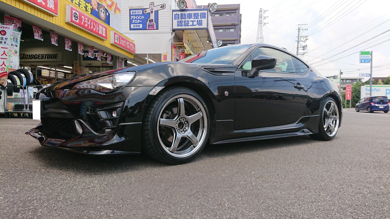Black coupe after changing wheels