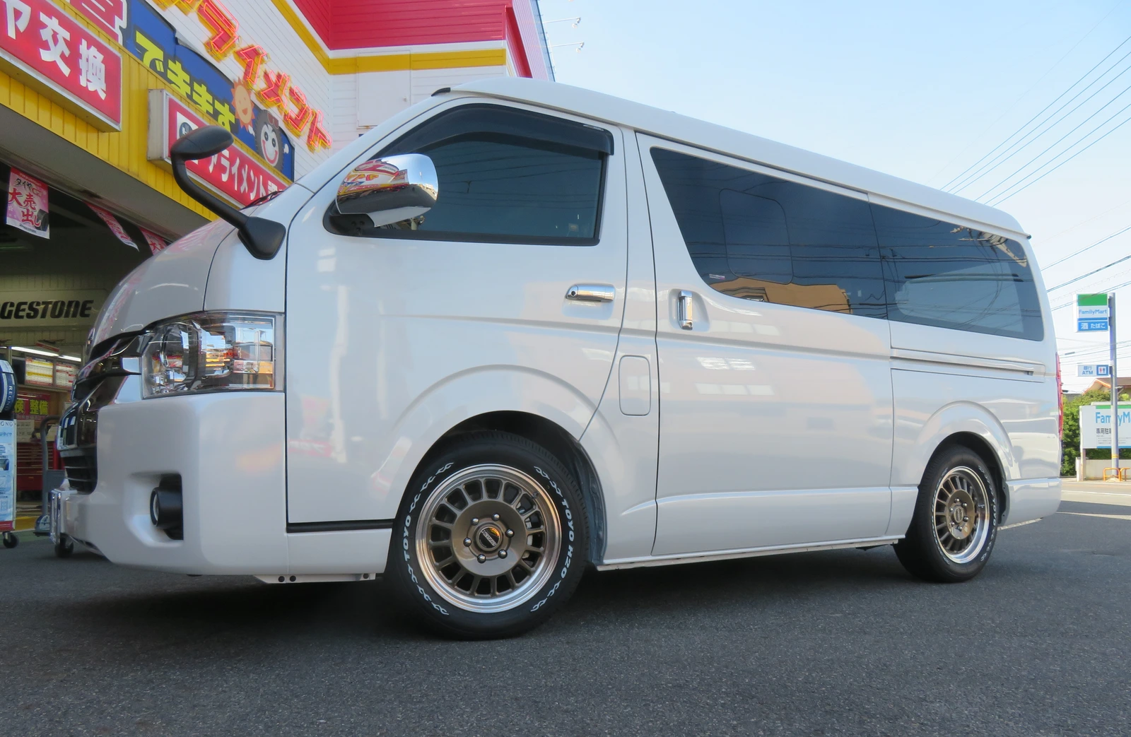 White minivan after changing wheels