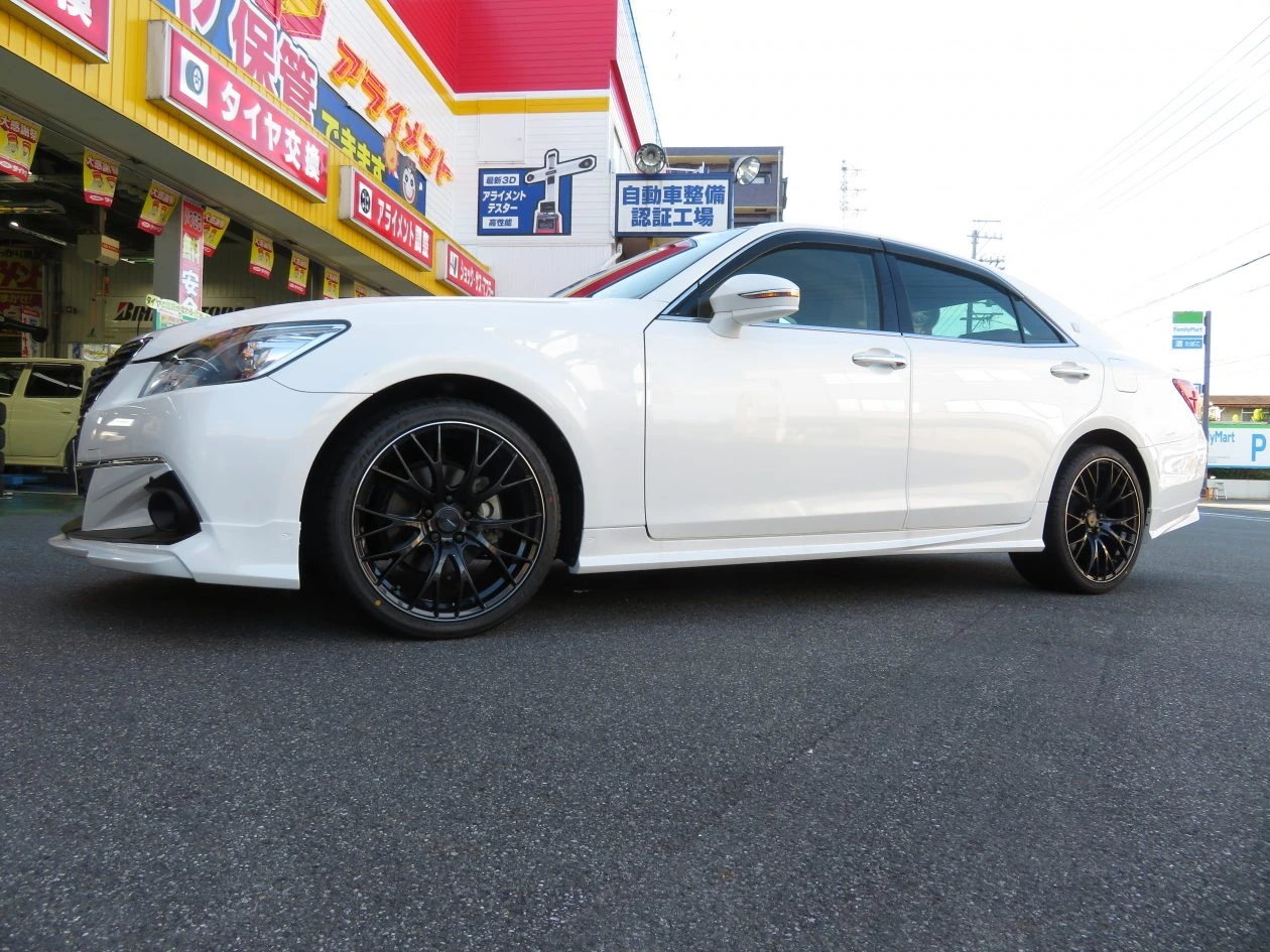 White sedan after changing wheels